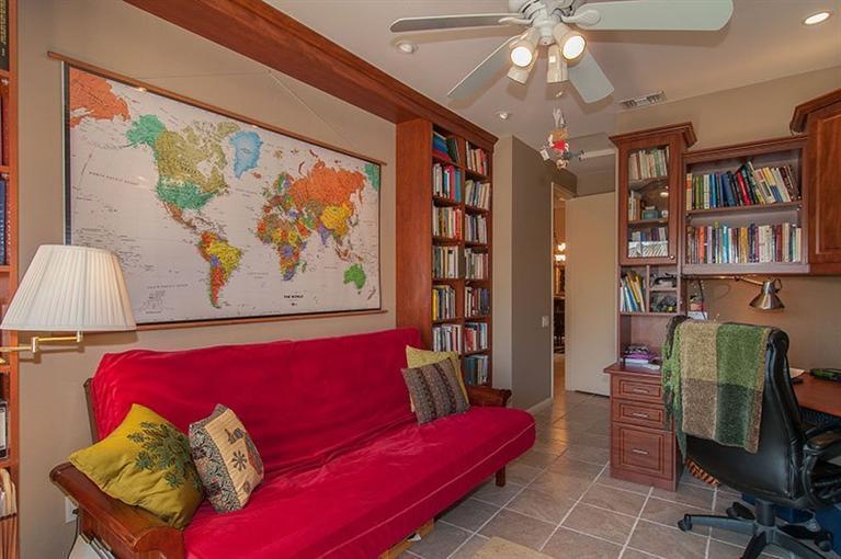 138 Lakeshore Drive Rancho Mirage, CA 92270 - Photo 16 of 24 a living room with furniture and a bookshelf