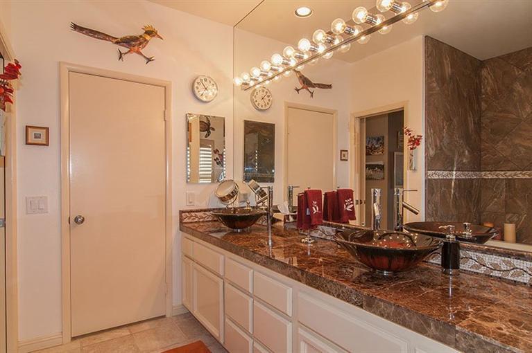 138 Lakeshore Drive Rancho Mirage, CA 92270 - Photo 19 of 24 a bathroom with a double vanity sink and a mirror