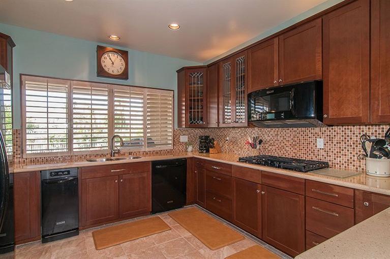 138 Lakeshore Drive Rancho Mirage, CA 92270 - Photo 2 of 24 a kitchen with a sink and cabinets