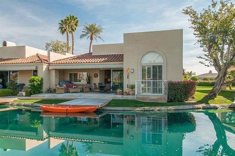 138 Lakeshore Drive Rancho Mirage, CA 92270 - Photo 22 of 24 a front view of a house with swimming pool having outdoor seating