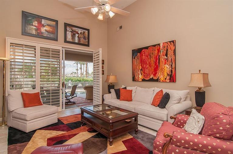 138 Lakeshore Drive Rancho Mirage, CA 92270 - Photo 3 of 24 a living room with furniture and a large window