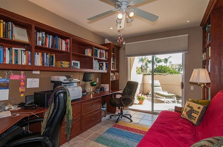 138 Lakeshore Drive Rancho Mirage, CA 92270 - Photo 5 of 24 a view of a workspace with furniture and a book shelf