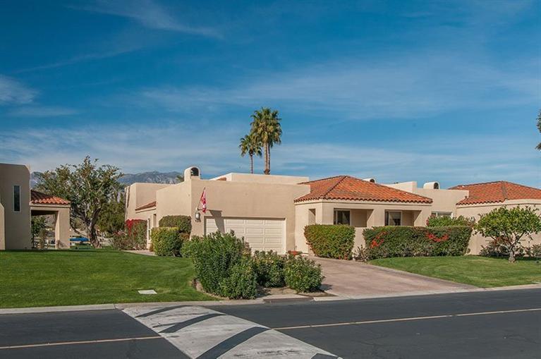 138 Lakeshore Drive Rancho Mirage, CA 92270 - Photo 6 of 24 a front view of a house with a yard