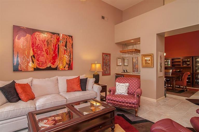 138 Lakeshore Drive Rancho Mirage, CA 92270 - Photo 8 of 24 a living room with furniture and painting on the wall