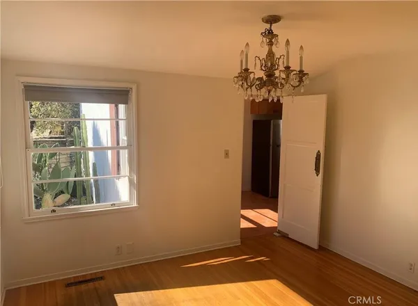a view of a hallway with a chandelier