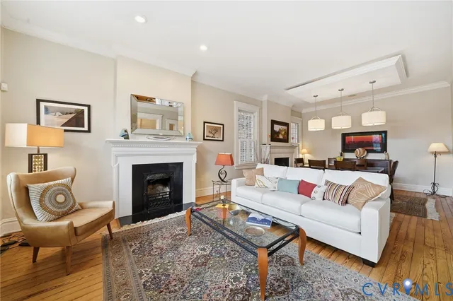 a living room with furniture and a fireplace