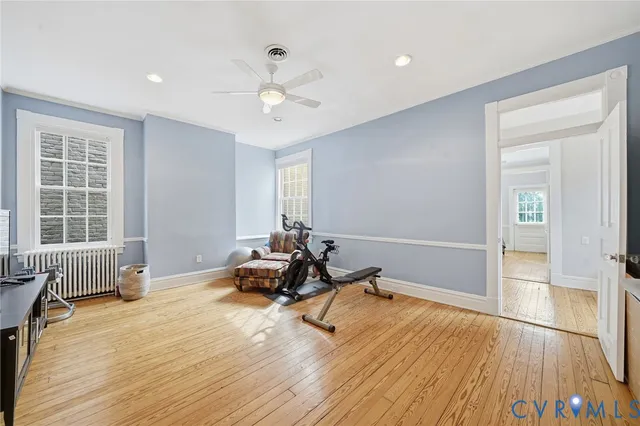a work room with furniture a rug and a fireplace