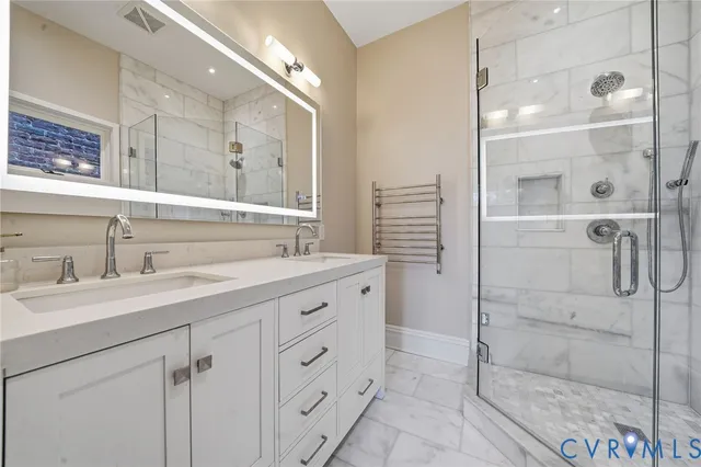 a view of a patio with couches chairs and wooden floor