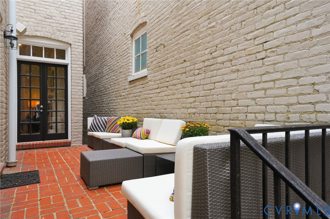 2005 Stuart Avenue Richmond, VA 23220 - Photo 26 of 29 a view of a patio with couches chairs and wooden floor