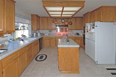 463 Noonan Ranch Lane Santa Rosa, CA 95403 - Photo 5 of 10 a kitchen with refrigerator and washer