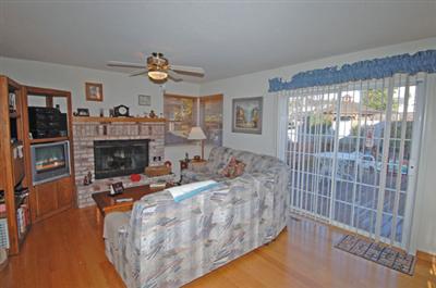 463 Noonan Ranch Lane Santa Rosa, CA 95403 - Photo 7 of 10 a living room with furniture a fireplace and a large window