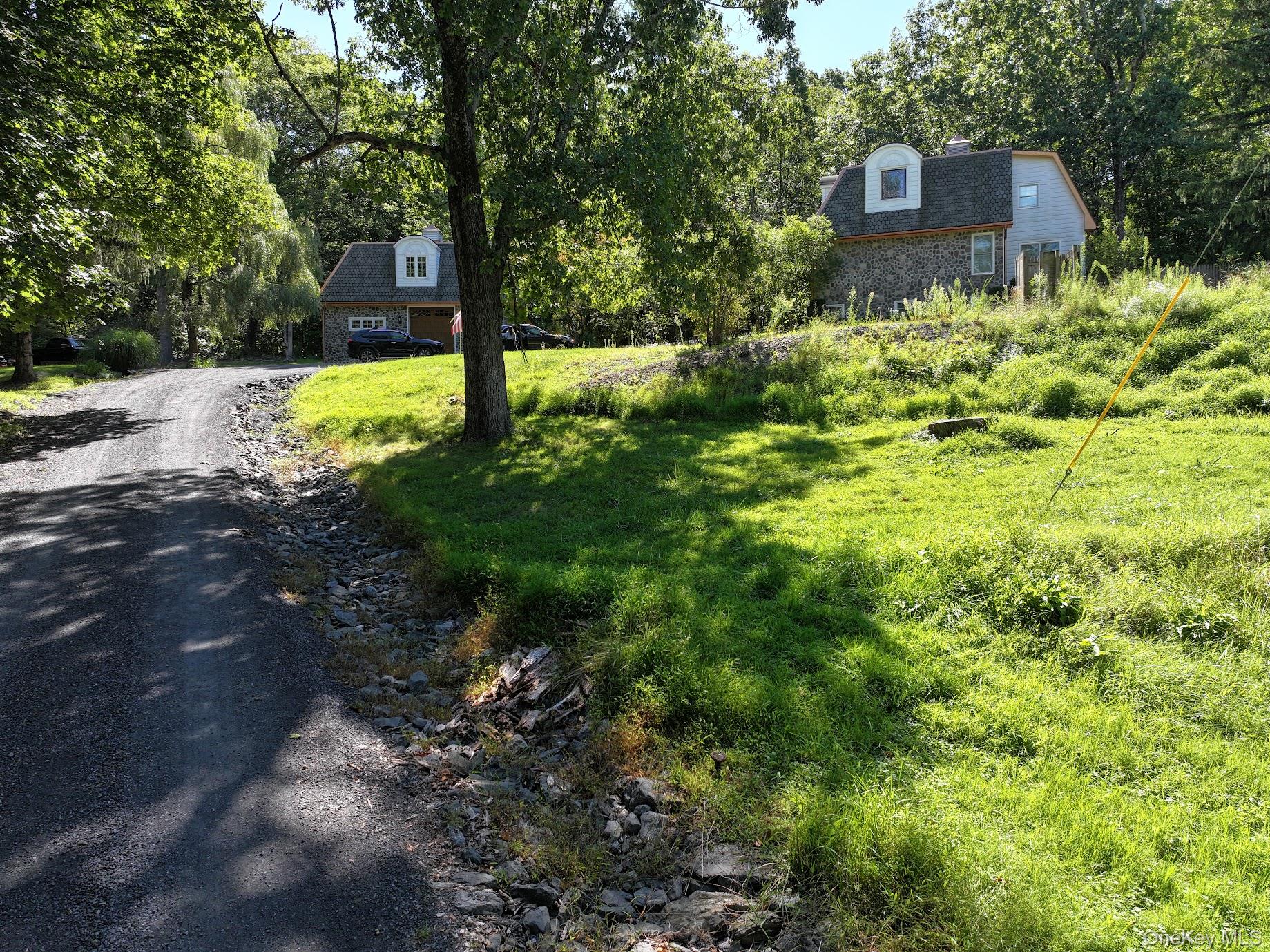 18 Denu Way Rhinecliff, NY 12574 - Photo 13 of 17 a view of a house with a yard and large trees