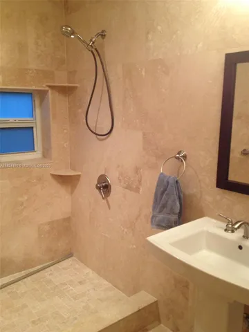 a bathroom with a sink and a mirror