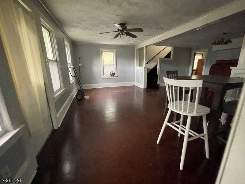 60 Vail Road Blairstown, NJ 07832 - Photo 13 of 26 a view of a livingroom with wooden floor and a ceiling fan