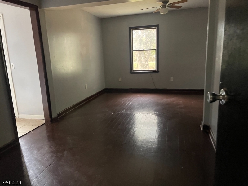 60 Vail Road Blairstown, NJ 07832 - Photo 18 of 26 an empty room with wooden floor and windows