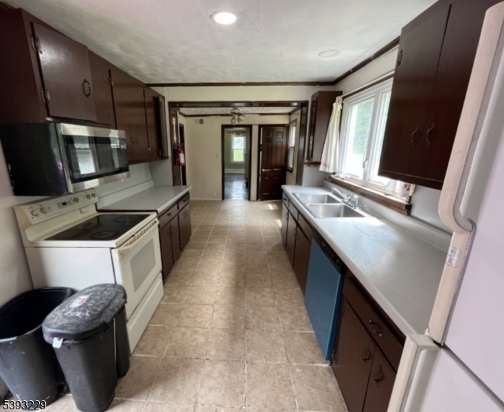 60 Vail Road Blairstown, NJ 07832 - Photo 2 of 26 a kitchen with a sink stove and cabinets