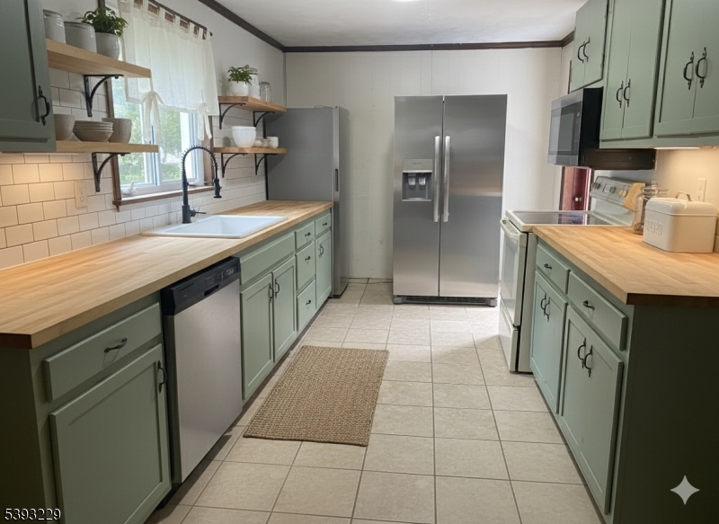 60 Vail Road Blairstown, NJ 07832 - Photo 21 of 26 a kitchen with stainless steel appliances granite countertop a sink and cabinets