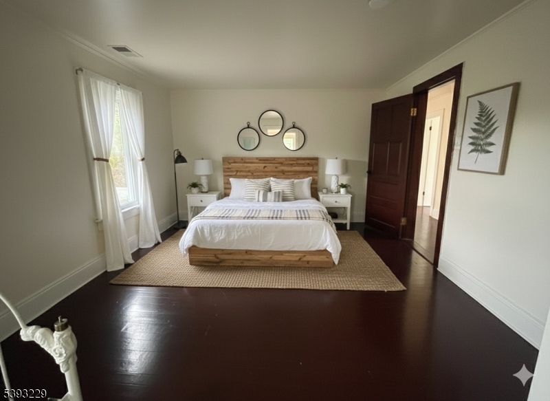 60 Vail Road Blairstown, NJ 07832 - Photo 24 of 26 a bedroom with a bed and wooden floor