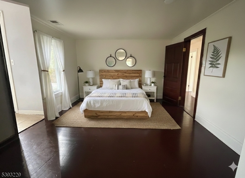 60 Vail Road Blairstown, NJ 07832 - Photo 26 of 26 a bedroom with a bed and wooden floor