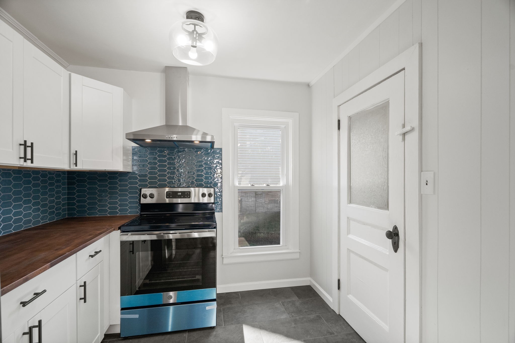 108 North Walnut Street Springfield, TN 37172 - Photo 8 of 32 a kitchen with stainless steel appliances a stove and a refrigerator