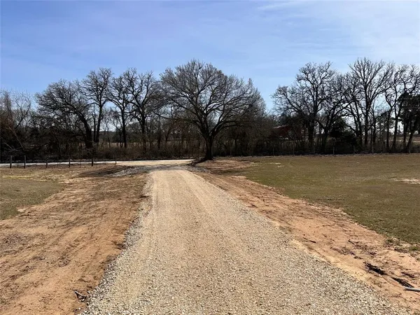 a view of road with trees