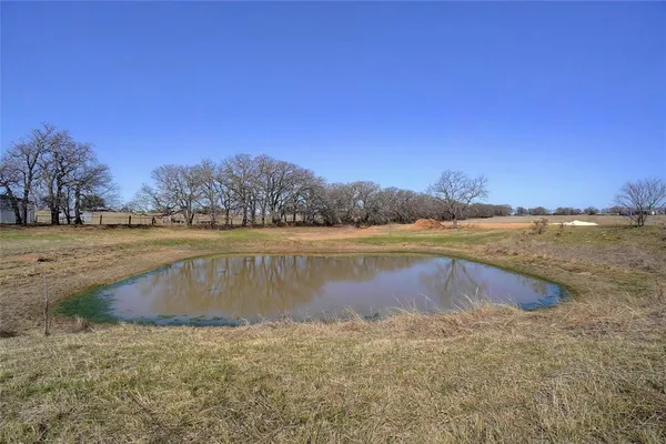 a view of a lake with a big yard