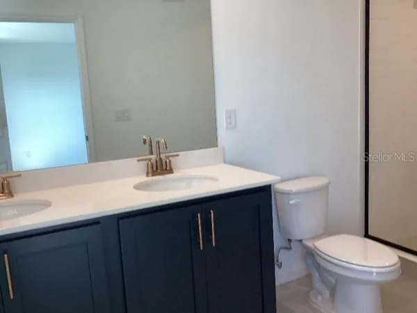 a bathroom with a sink and a toilet