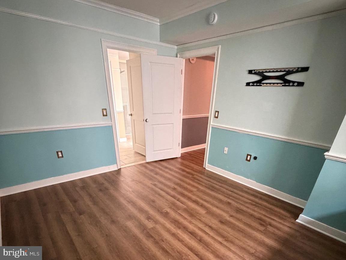 555 Massachusetts Avenue Northwest, Unit 815 Washington, DC 20001 - Photo 13 of 20 a view of a room with wooden floor and white walls