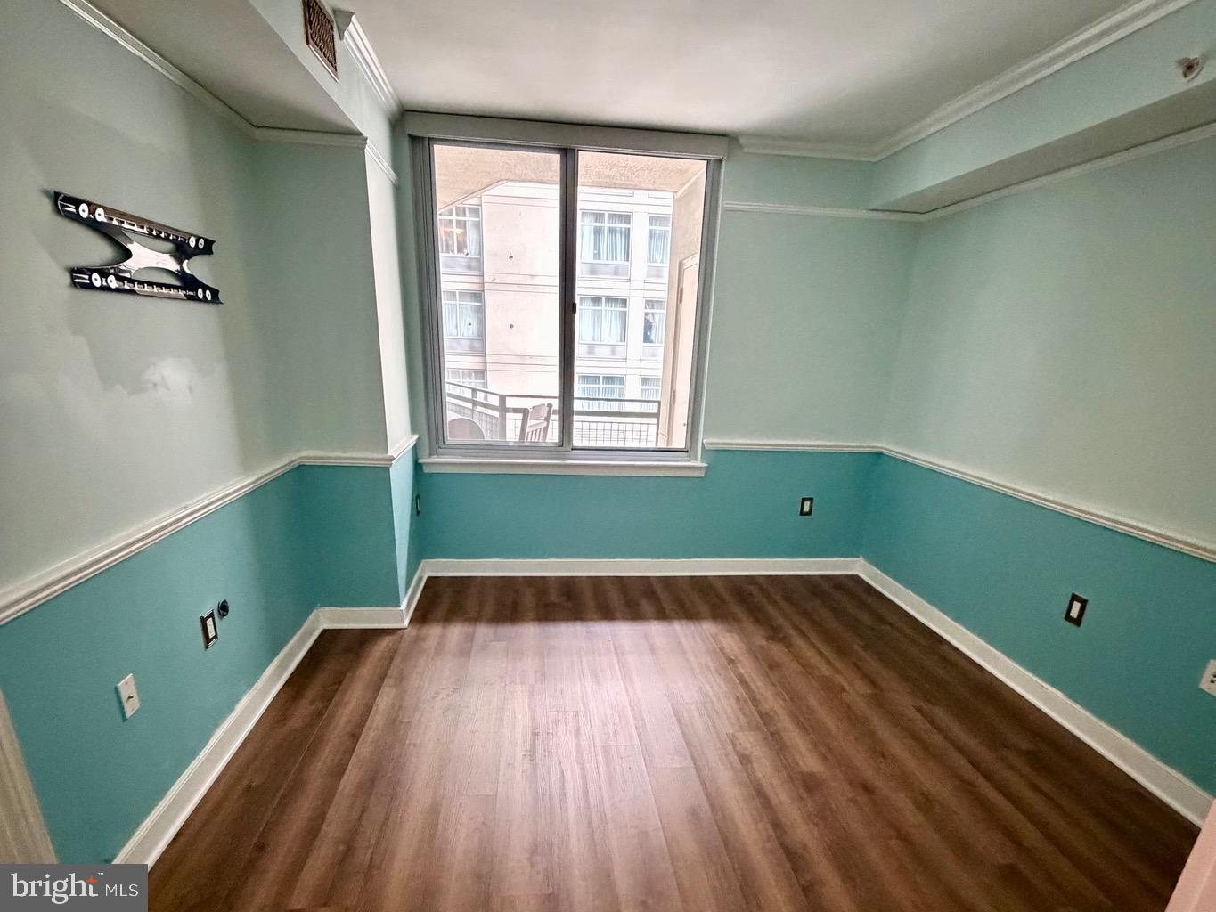 555 Massachusetts Avenue Northwest, Unit 815 Washington, DC 20001 - Photo 14 of 20 a view of a room with wooden floor and windows