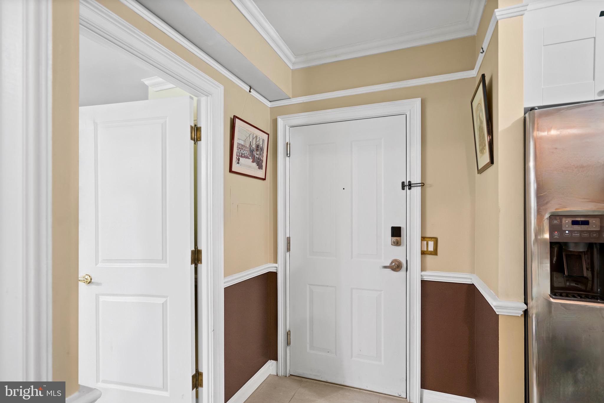 555 Massachusetts Avenue Northwest, Unit 815 Washington, DC 20001 - Photo 4 of 20 a view of a hallway with wooden floor and closet area