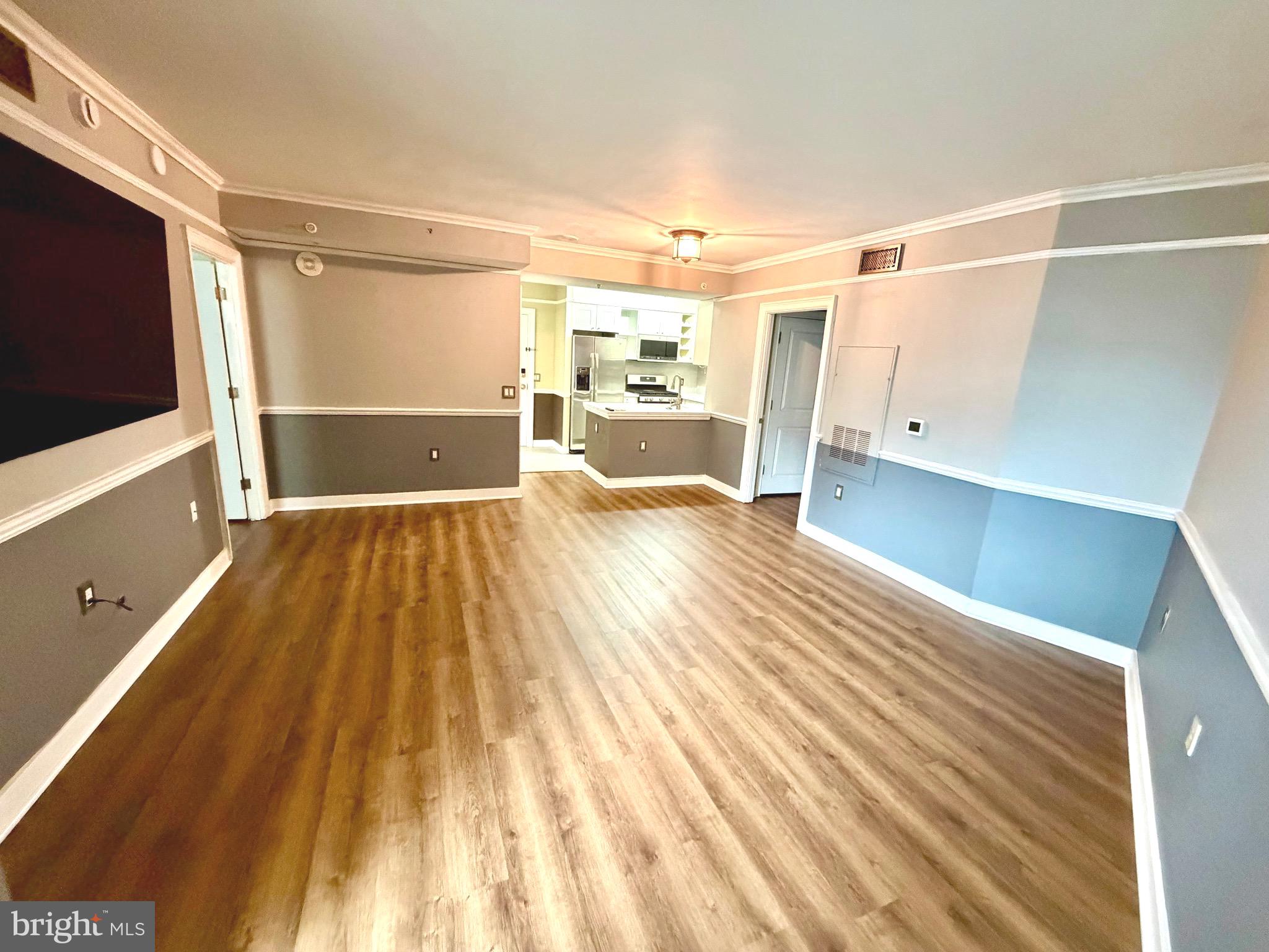 555 Massachusetts Avenue Northwest, Unit 815 Washington, DC 20001 - Photo 7 of 20 a view of a living room with a flat screen tv