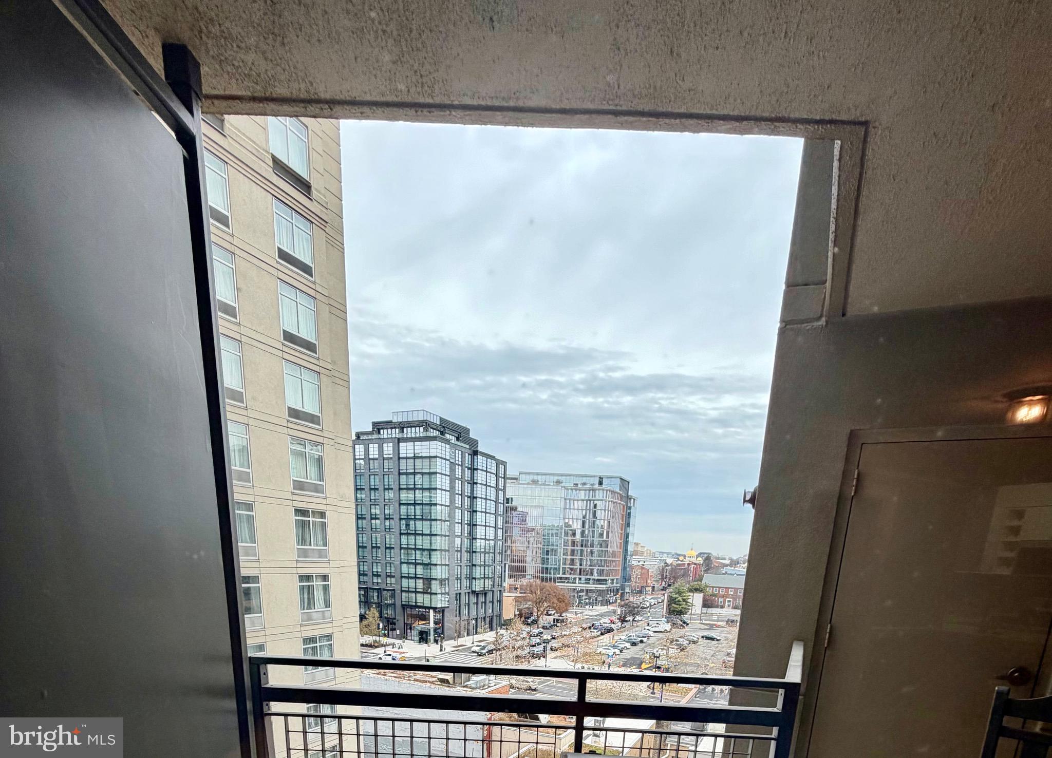 555 Massachusetts Avenue Northwest, Unit 815 Washington, DC 20001 - Photo 9 of 20 a view of a balcony with city view