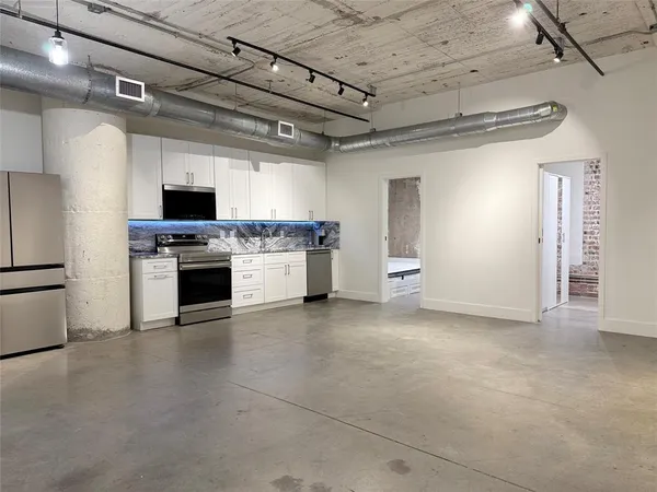 a view of a kitchen with a stove cabinets and a kitchen