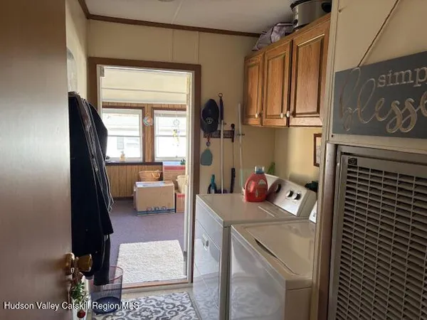 a bedroom with a bed and cabinets