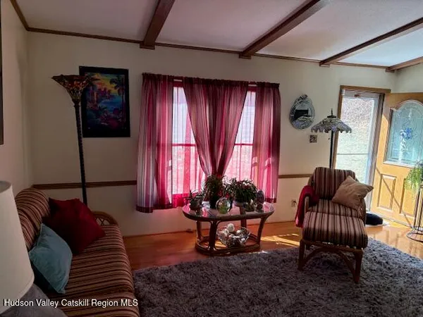 a living room with furniture and a window
