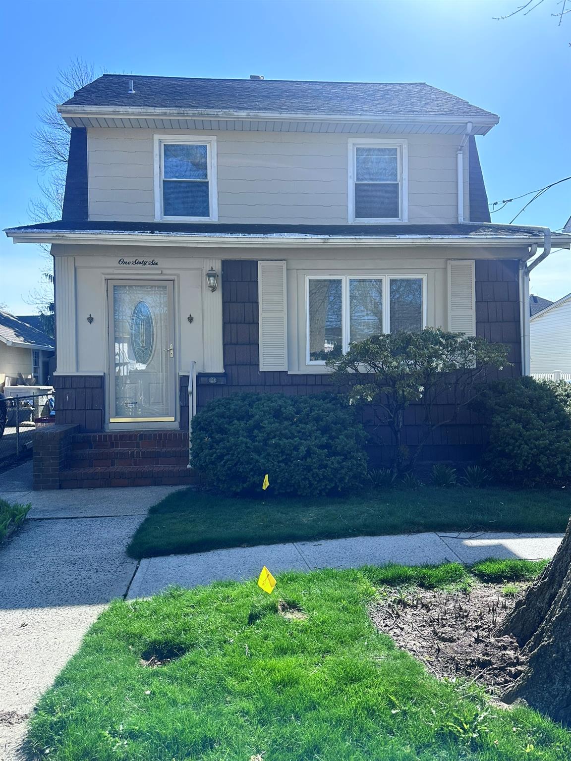 a front view of a house with a yard