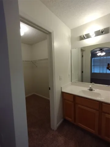 a bathroom with a double vanity sink and mirror
