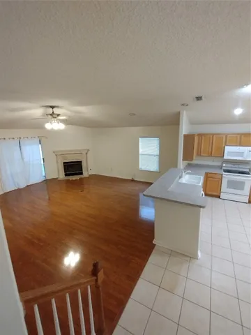 a view of a livingroom with furniture and a window