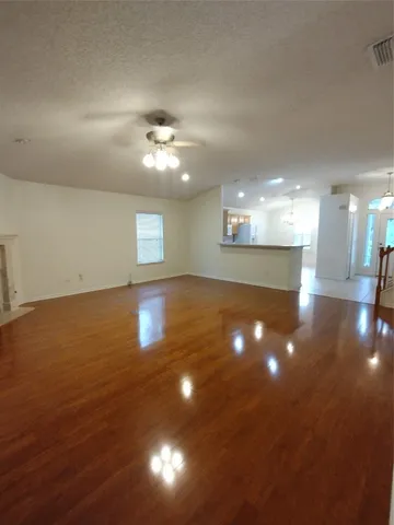 a view of a room has a kitchen