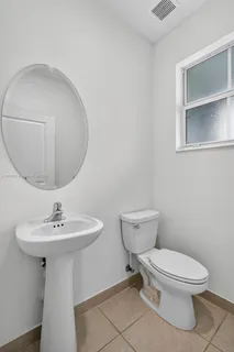 a view of an entryway with wooden floor and door