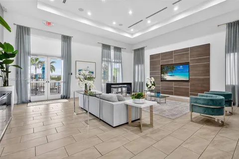a living room with fireplace furniture and a flat screen tv