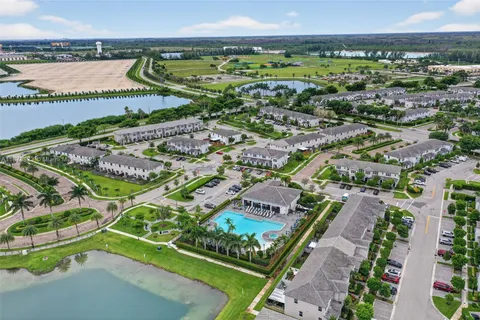 an aerial view of residential building and parking space