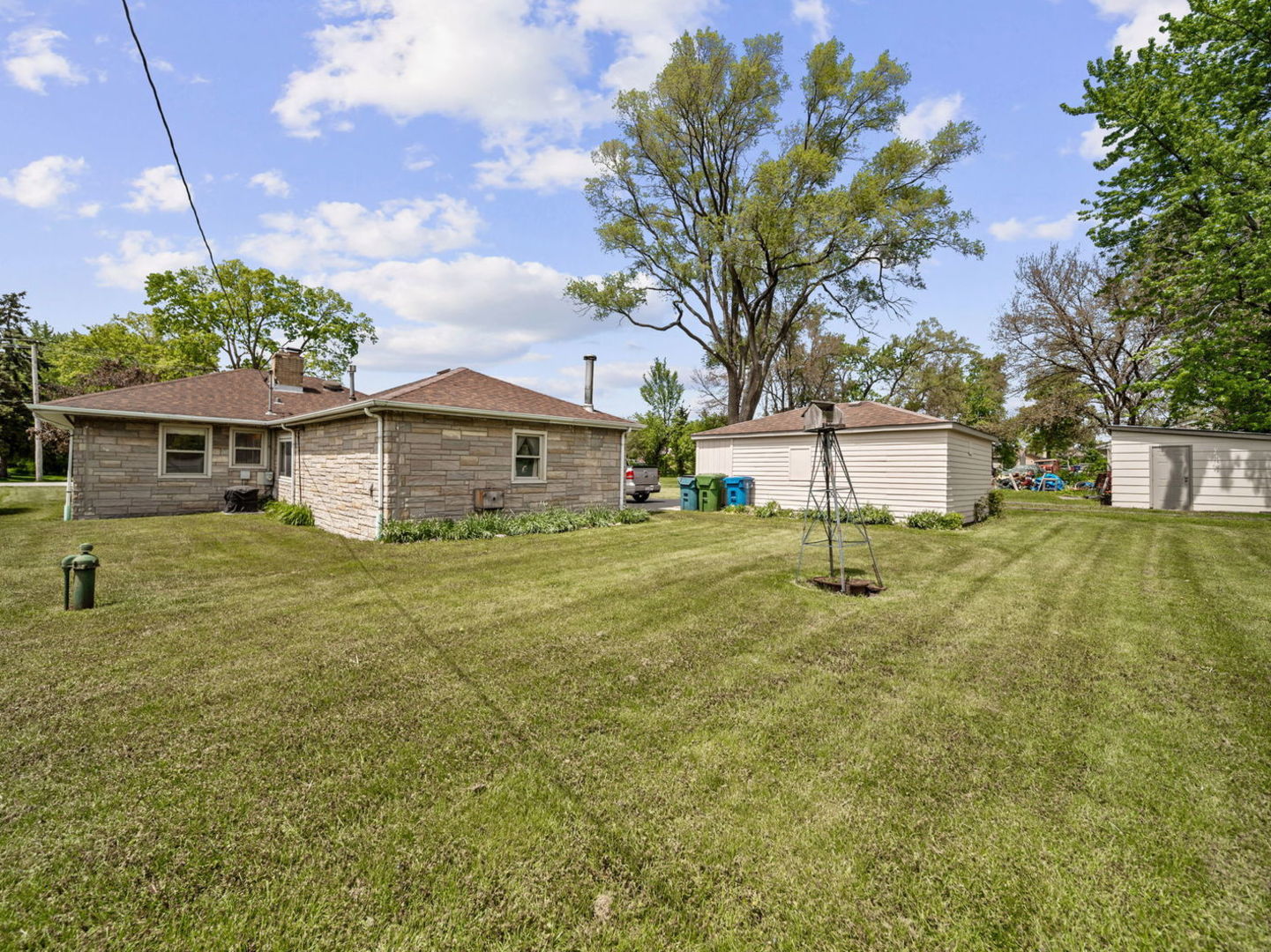 4N365 9th Avenue Addison, IL 60101 - Photo 18 of 24 a front view of a house with a yard and garage