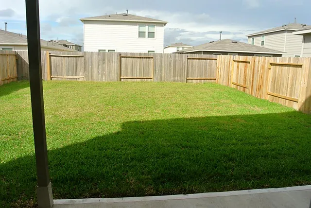 a view of a back yard from a patio