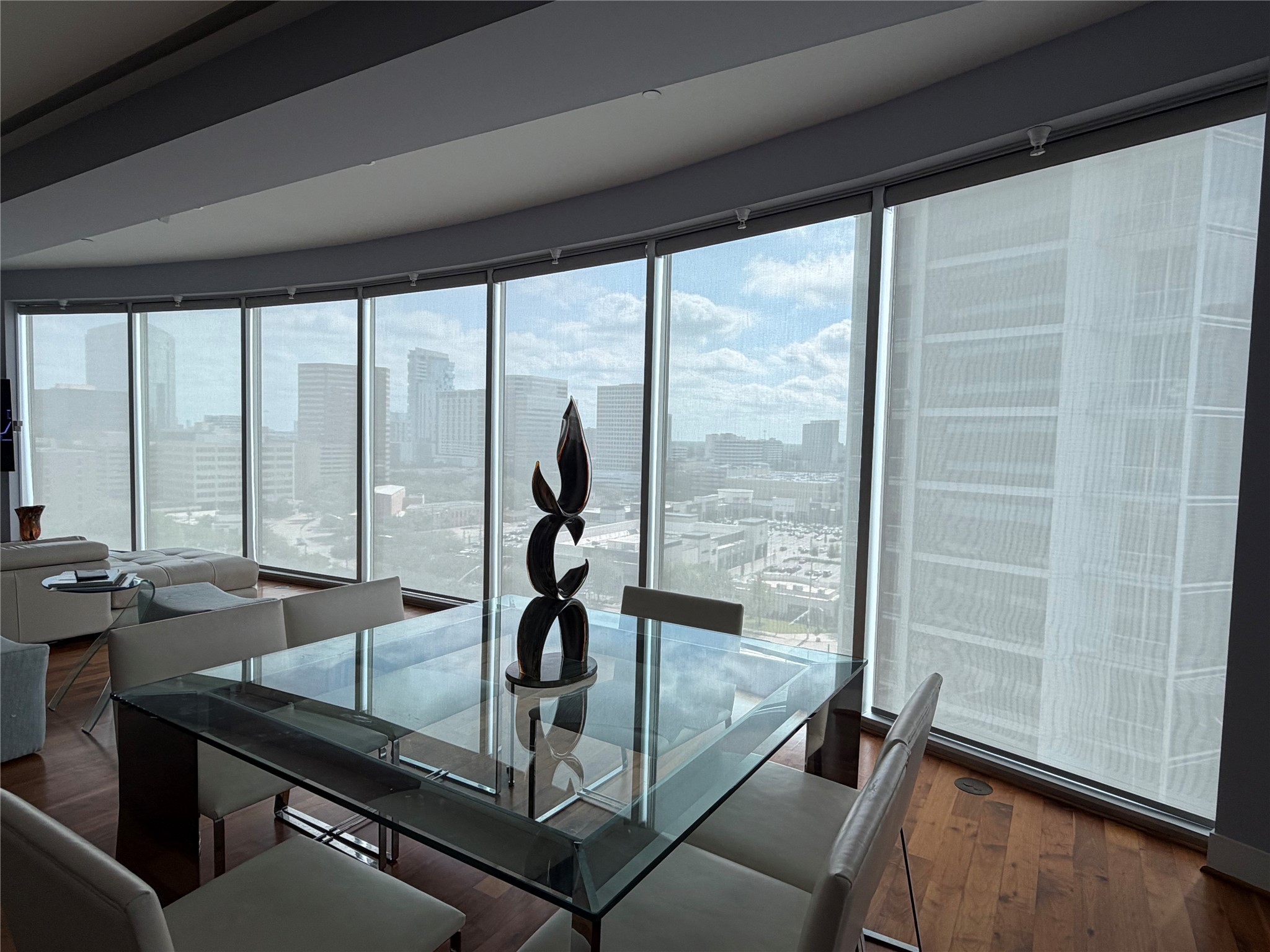 1600 Post Oak Boulevard, Unit 1206 Houston, TX 77056 - Photo 14 of 50 Custom SOMFY Power Shades on every window. Multl-Channel Hand-Held Remotes. See through Mesh in Living Room and Black-Out in Bedroom. Very Cool and impressive for your family and guests.