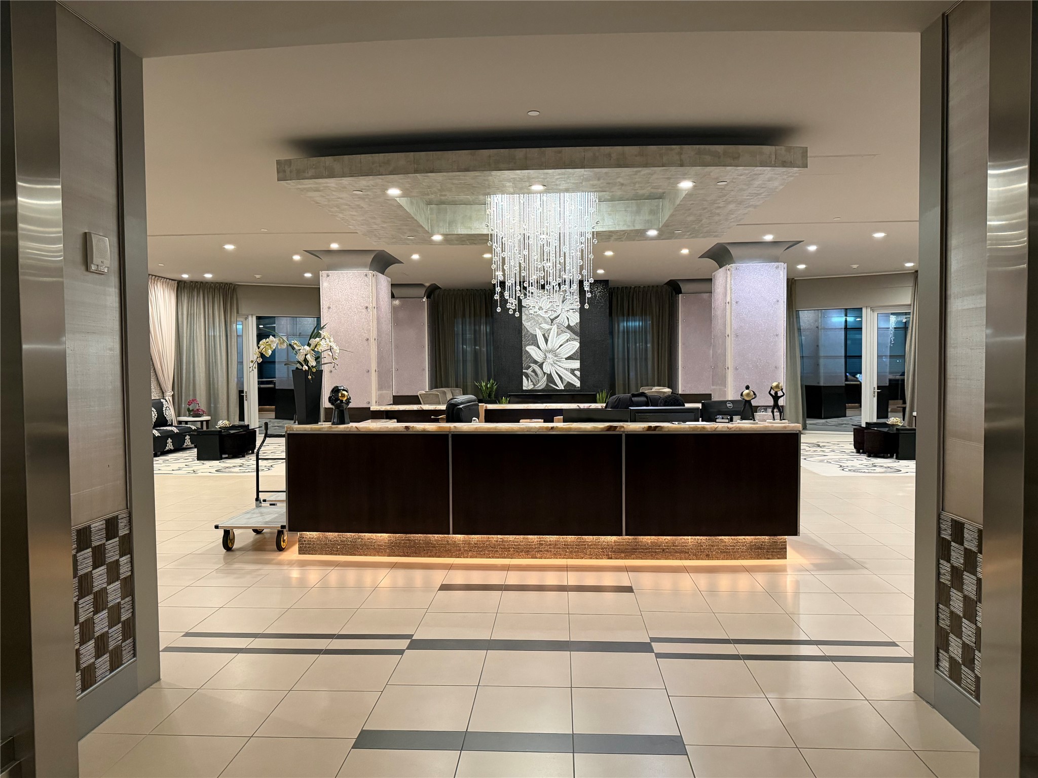 1600 Post Oak Boulevard, Unit 1206 Houston, TX 77056 - Photo 39 of 50 7th Floor Concierge Desk and General Public Area including State of the Art Cybex Fitness Center, WIne Room, Theater, and Pool with Green Area and Teak Wood area.