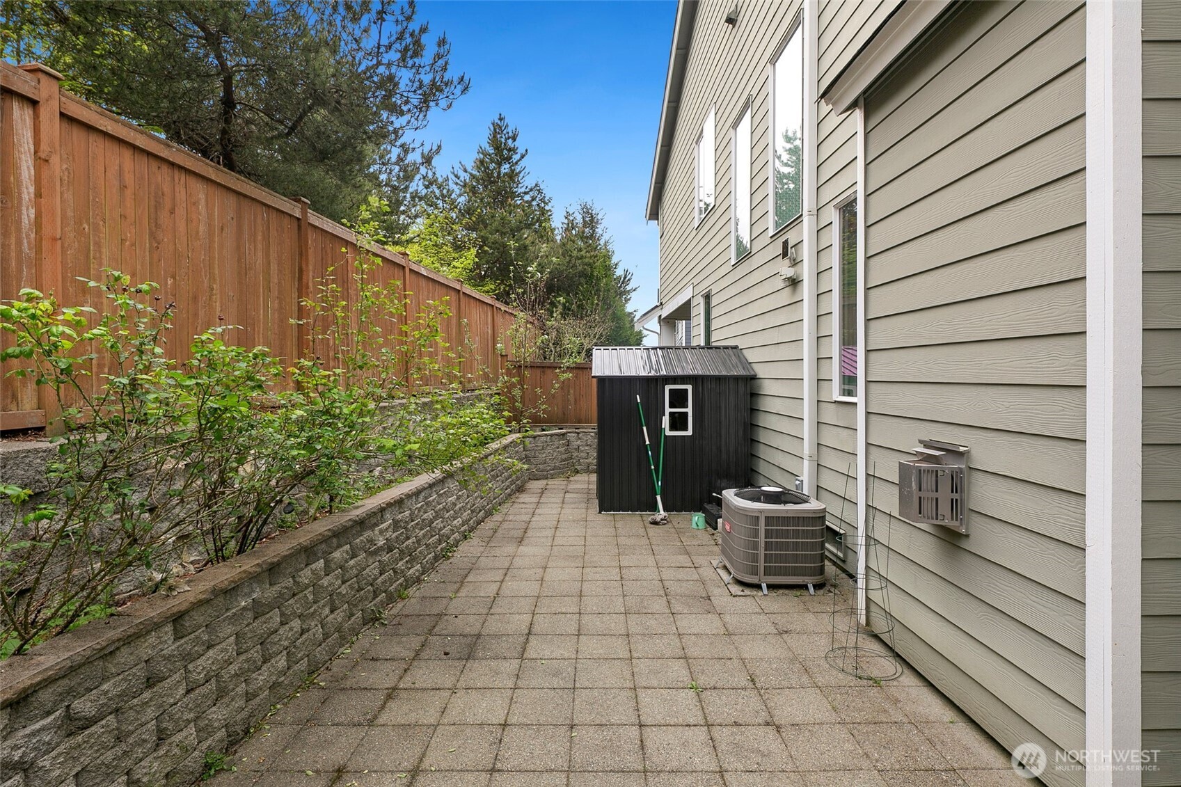 3931 177th Street Southeast Bothell, WA 98012 - Photo 35 of 39 a view of a back yard of the house and a chair