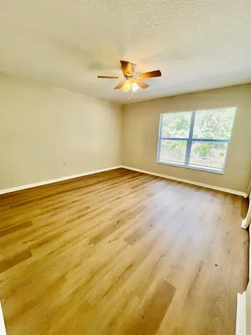 a bathroom with a toilet a sink and a mirror