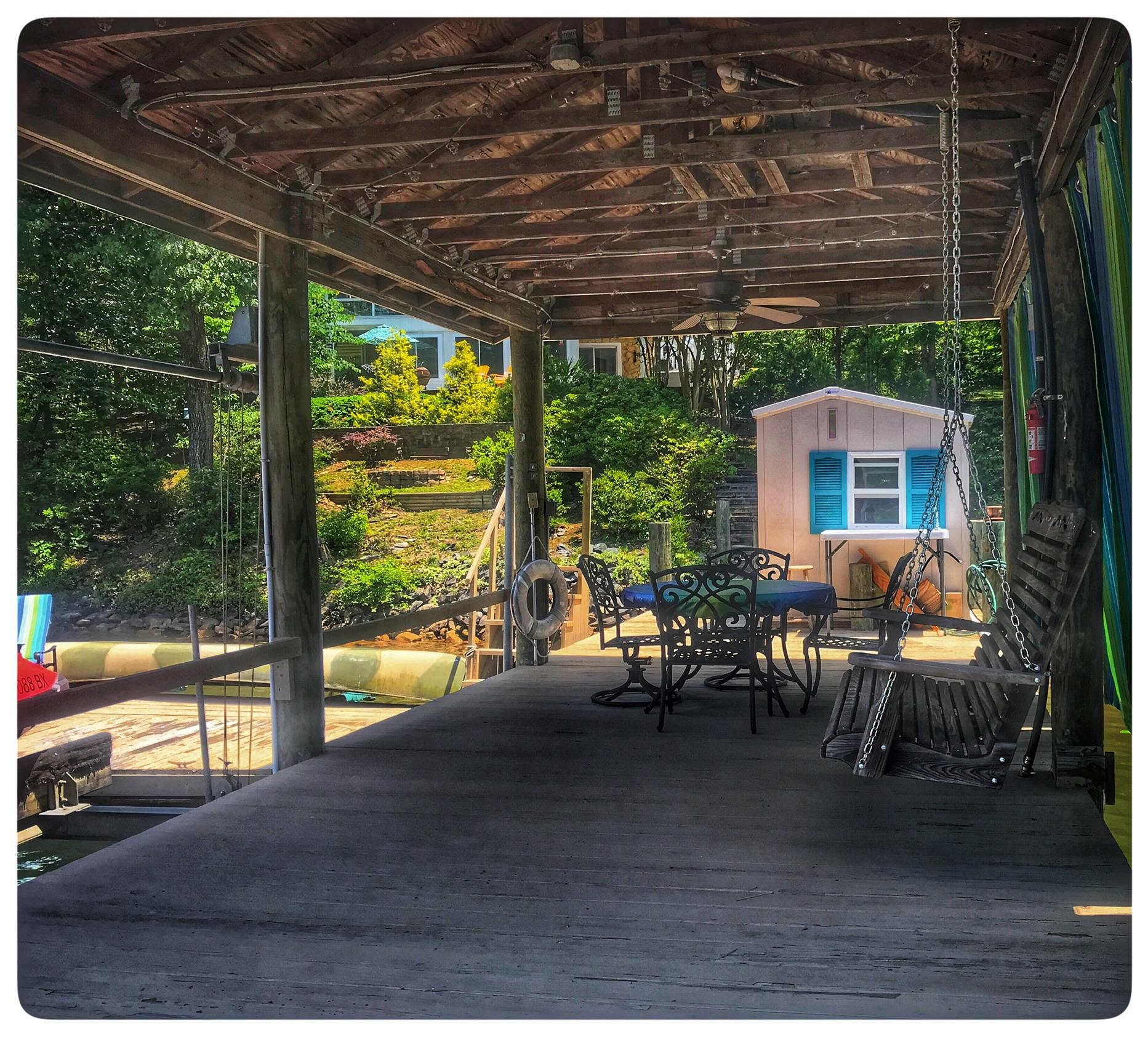 131 Highland Lake Road Union Hall, VA 24176 - Photo 27 of 75 a view of a patio with couches chairs and potted plants