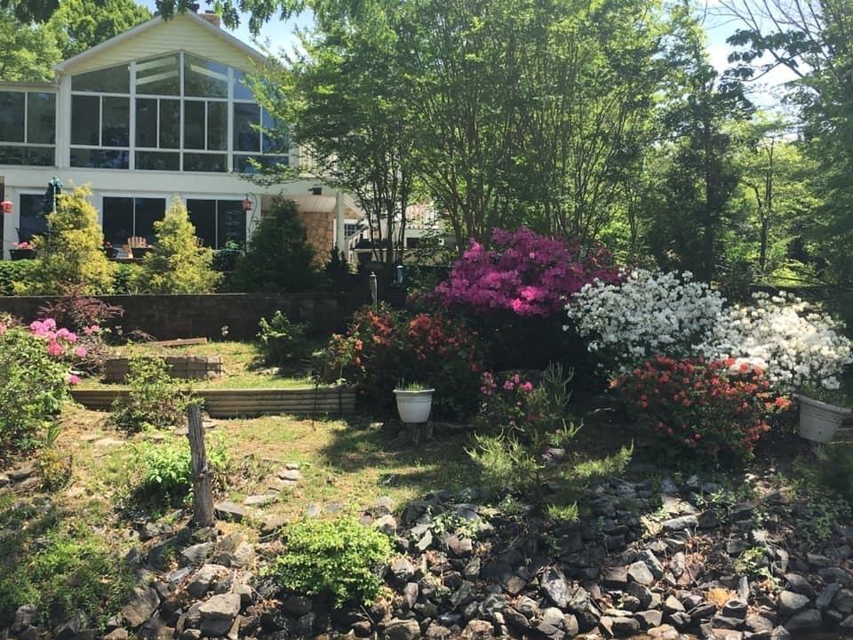 131 Highland Lake Road Union Hall, VA 24176 - Photo 29 of 75 a front view of a house with a yard and a fountain